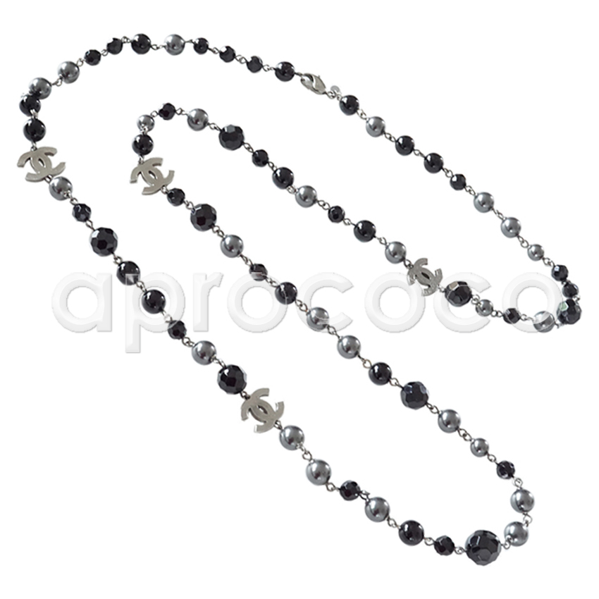 Sold at Auction: Chanel - Pearl Necklace - Black & Gold 47 Long Beaded CC  Logo Charms